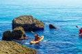 Senior kayaker on a kayak by the sea, active water sport and lei