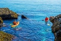 Senior kayaker on a kayak by the sea, active water sport and lei