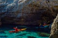 Senior kayaker on a kayak by the sea, active water sport and lei