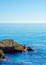 Senior kayaker on a kayak by the sea, active water sport and lei