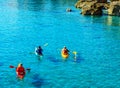 Senior kayaker on a kayak by the sea, active water sport and lei