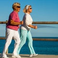 Senior ladies jogging at seaside. Royalty Free Stock Photo