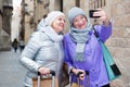 Senior ladies making selfie outdoors