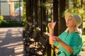 Senior lady is blowing bubbles. Royalty Free Stock Photo