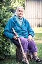 Senior lady with a cane, countryside people