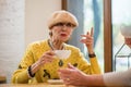 Senior lady with cup. Royalty Free Stock Photo