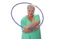 Senior lady doing gymnastic with hula-hoop Royalty Free Stock Photo