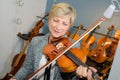 Senior lady playing violin Royalty Free Stock Photo