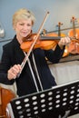 senior lady playing violin Royalty Free Stock Photo