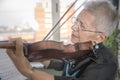 Senior lady playing violin Royalty Free Stock Photo