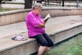 Serene Summer Retreat: Elderly Woman Embraces Relaxation in Hot Spa Royalty Free Stock Photo