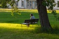 senior lady sitting on park bench