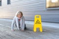 Senior lady slipping and falling on a wet surface