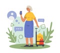 Senior lady standing outside with bags, using smartphone for communication Royalty Free Stock Photo