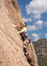 Senior lady on steep rock climb in Colorado Royalty Free Stock Photo