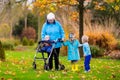 Senior lady with walker enjoying family visit Royalty Free Stock Photo