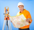 Senior land surveyor with theodolite