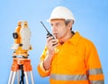 Senior land surveyor with theodolite