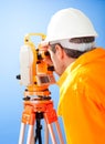 Senior land surveyor with theodolite