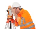 Senior land surveyor with theodolite