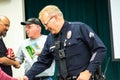 Senior Lead Officer Sellers speaks to residents at a neighborhood watch LAPD basic car meeting at Granada Hills High School