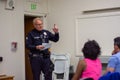 Senior Lead Officer Sellers speaks to residents at a neighborhood watch LAPD basic car meeting at Granada Hills High School.