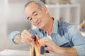 senior male carpenter using level on wood board Royalty Free Stock Photo