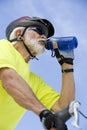 Senior Male Cyclist Drinking Water