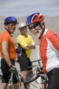 Senior Male Cyclist With Friends Standing In The Background Royalty Free Stock Photo