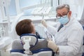 Senior dentist working at his clini Royalty Free Stock Photo