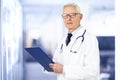 Senior male doctor portrait while standing in the hospital Royalty Free Stock Photo