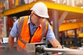 Senior male engineer supervisor working in metal manufactory work checking production line