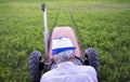 Senior male farmer sitting on a tractor