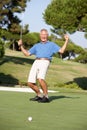 Senior Male Golfer On Golf Course