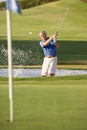 Senior Male Golfer Playing Bunker