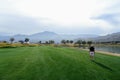 A senior male golfer standing in middle of the fairway on a par 4 on a golf course in Palm Springs, California, United States Royalty Free Stock Photo