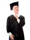 Senior male graduate looking up and daydreaming Royalty Free Stock Photo