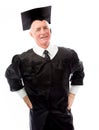 Senior male graduate standing with his arms akimbo