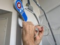 Senior male hand holding patient lifting pole with grab handle and signal