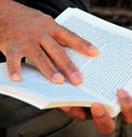 Senior male hands holding a book