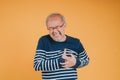 Senior male having chest pain his suffer from cardiac heart attack. Old elderly man patient has difficulty breath his chest. Royalty Free Stock Photo