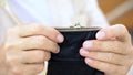 Senior male holding wallet, social security, payments for pensioners, protection Royalty Free Stock Photo