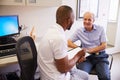 Senior Male Patient Working With Physiotherapist In Hospital Royalty Free Stock Photo