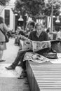 Senior male reading Chinese newspapers in Kuala Lumpur, Malaysia