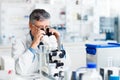 Senior male researcher carrying out scientific research in a lab Royalty Free Stock Photo