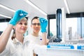 ResearcherÃâº carrying out scientific research in a lab using a gas chromatograph Royalty Free Stock Photo