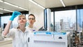 Two young researchers carrying out experiments in a lab Royalty Free Stock Photo