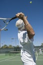 Senior Male Tennis Player Serving Royalty Free Stock Photo