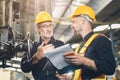 senior male worker training new young engineer employee working in heavy industry metal factory Royalty Free Stock Photo
