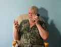 Senior man annoyed on mobile cell phone. Royalty Free Stock Photo